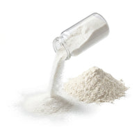 Fine white xanthan gum powder pouring from a jar